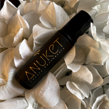 Load image into Gallery viewer, Pure Mimose Roll-On Fragrance bottle on a white flowers background