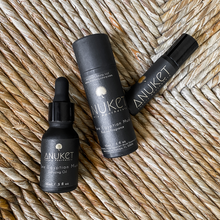 Load image into Gallery viewer, Pure Egyptian Musk Diffusing Oil bottle and Pure Egyptian Musk roll-on fragrance bottle and box displayed on a straw background
