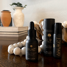 Load image into Gallery viewer, Pure Mimose Diffusing Oil bottle, box and Pure Mimose roll-on fragrance displayed with a background with white wooden beads books and vases