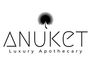 Anuket Luxury Apothecary logo in black with papyrus leaf icon 