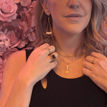 Load image into Gallery viewer, Woman wearing Sceptre Necklace- Fragrance Diffusing Demi-Fine Jewellery around her neck with a flower background