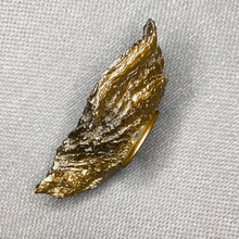 Load image into Gallery viewer, Gold glided oyster side displayed on a light taupe background