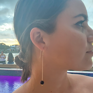 Woman wearing Tut Fragrance Diffusing Earrings